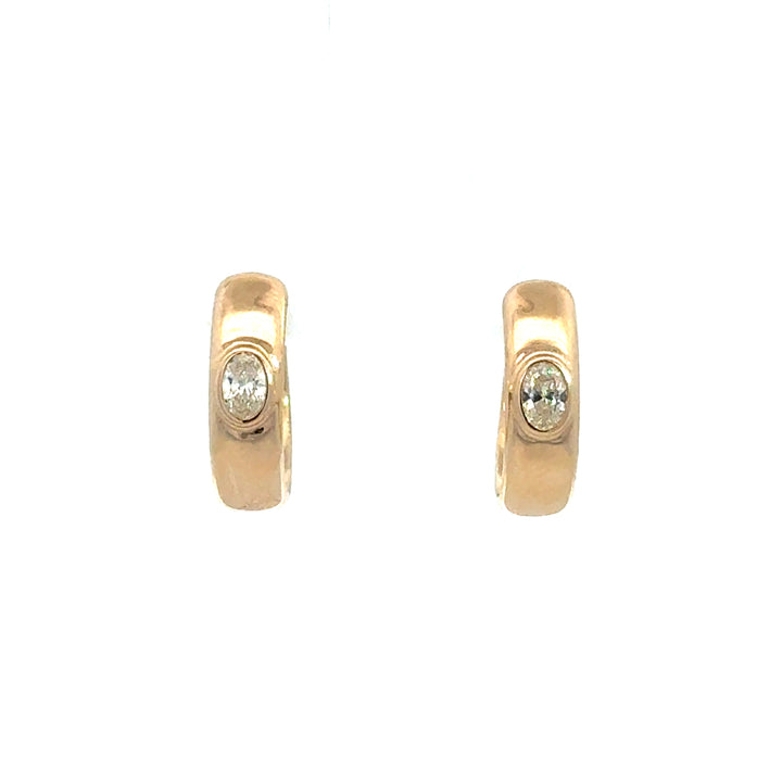 14k Yellow Gold Flush set Oval Diamond Huggies