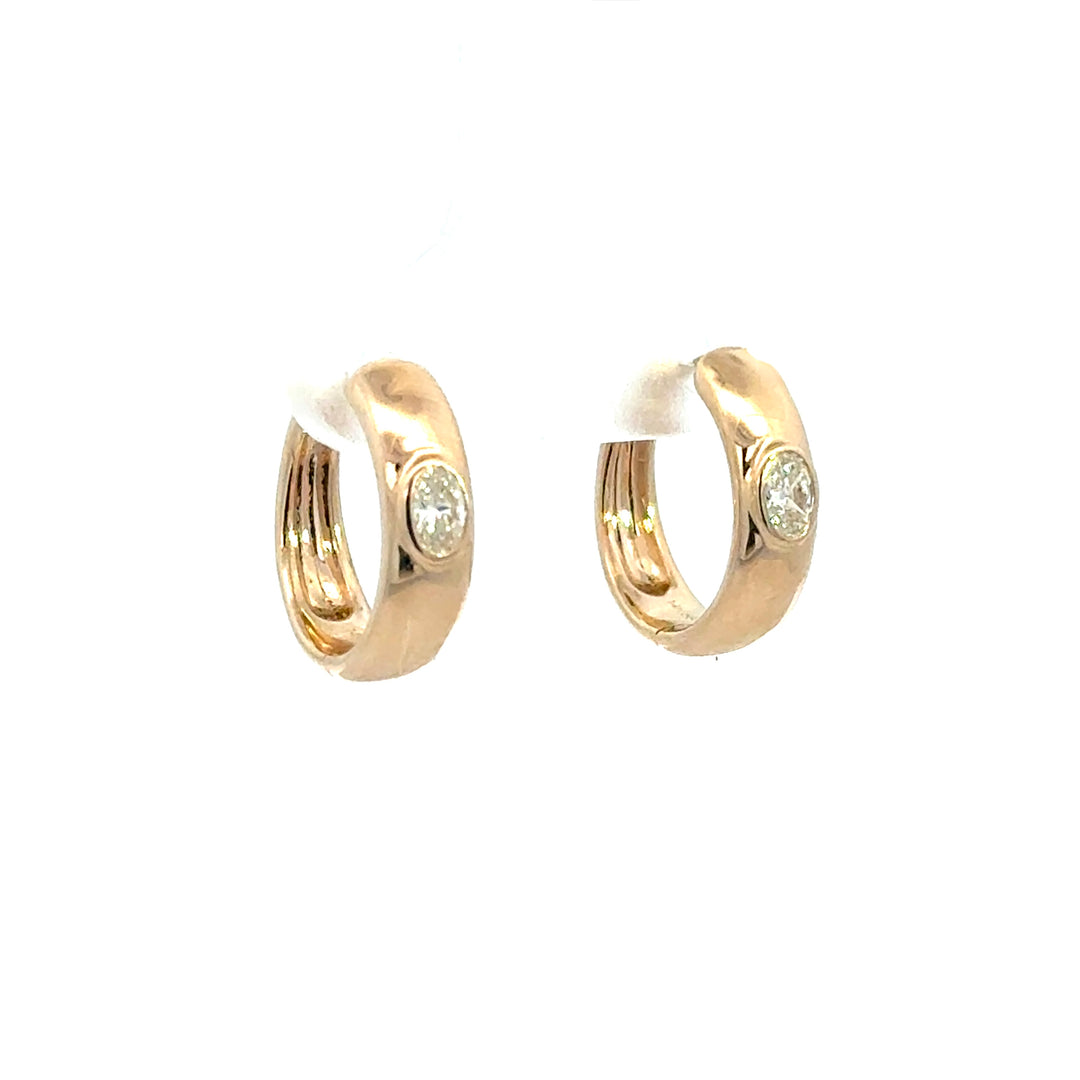 14k Yellow Gold Flush set Oval Diamond Huggies