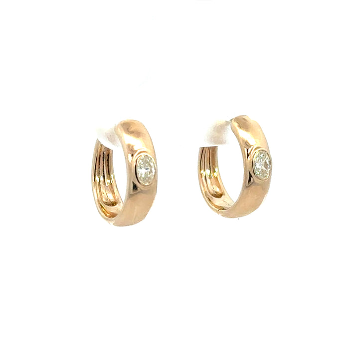 14k Yellow Gold Flush set Oval Diamond Huggies