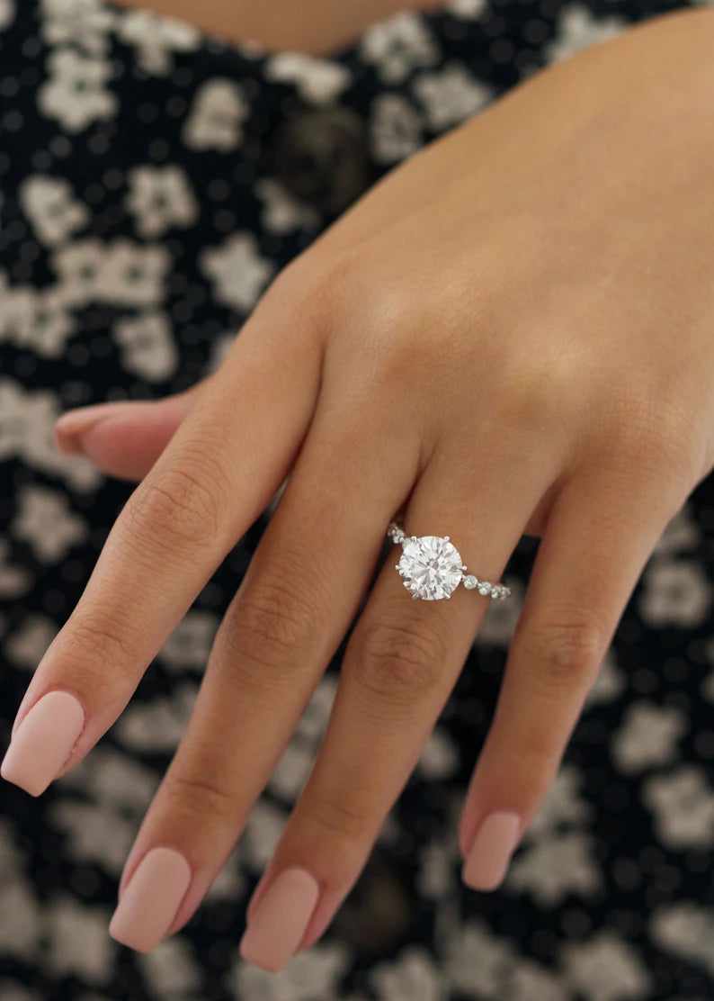 custom engagement ring worn by a woman